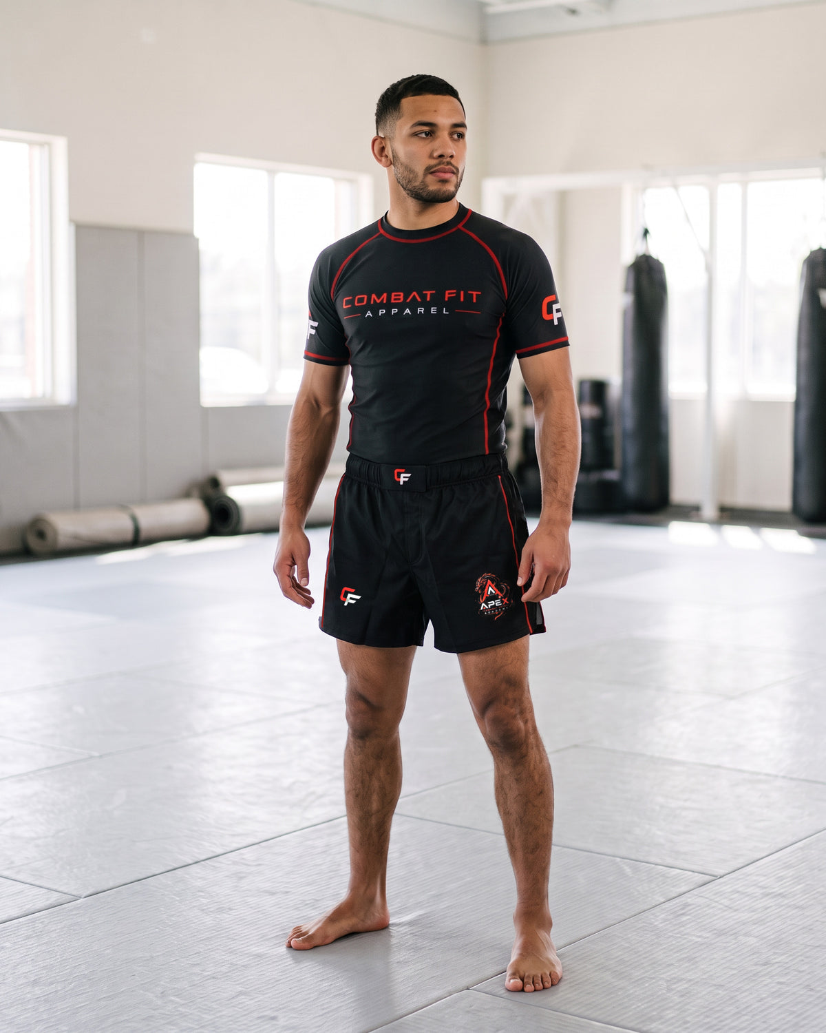 Model wearing the CF × Apex Rashguard Set on the mats, front view
