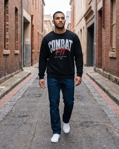 Combat Crew Neck Sweatshirt in Black, worn on a street