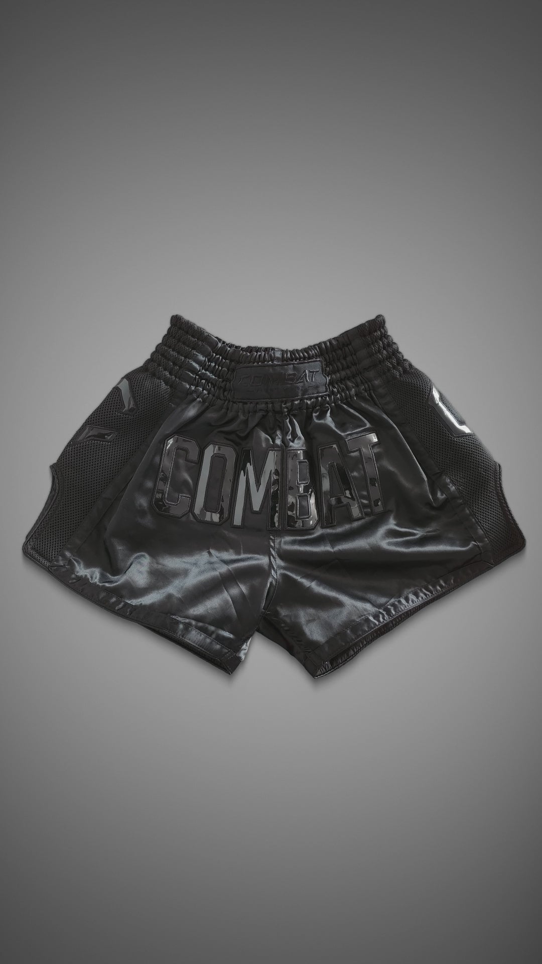 Combat Muay Thai Shorts in black turning from front to side