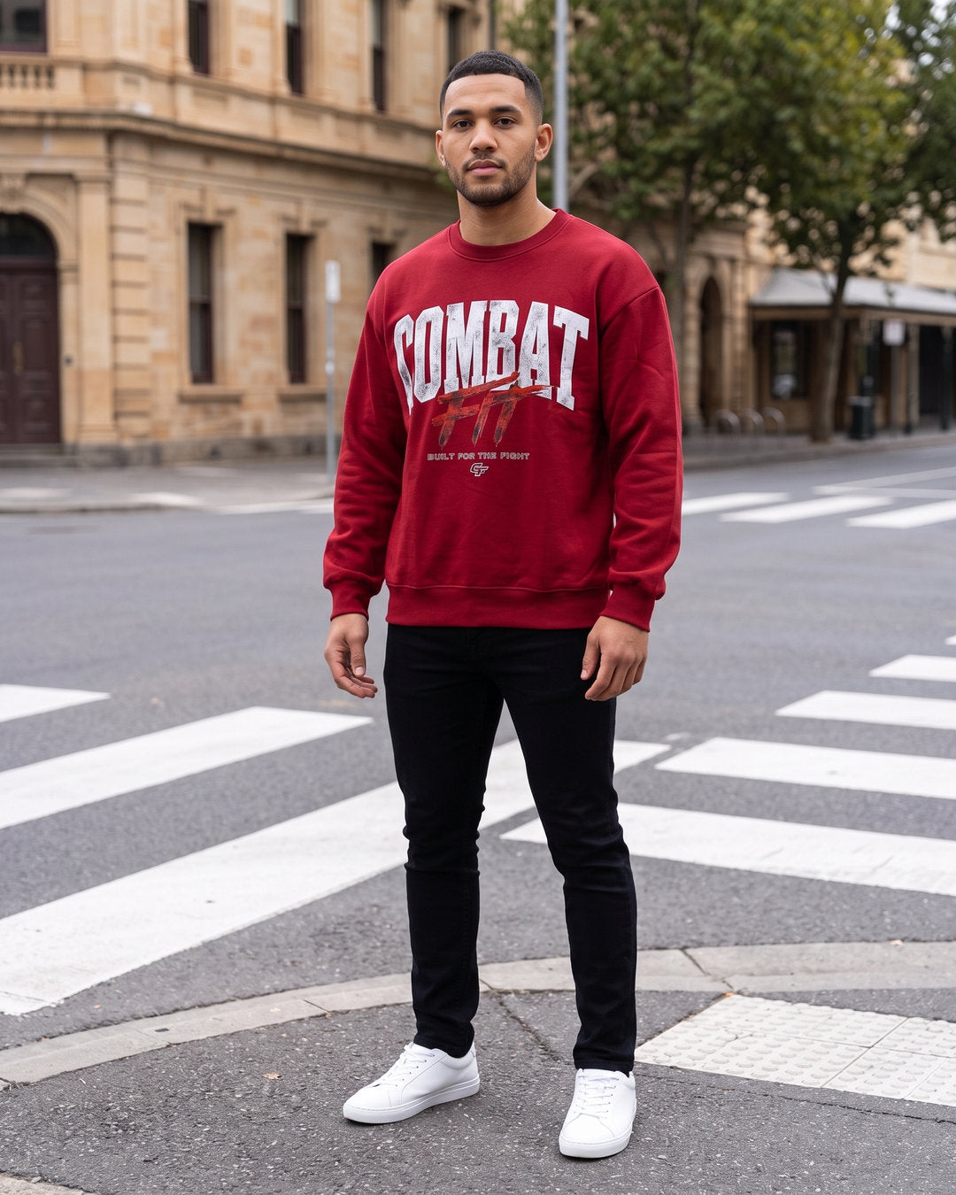 Combat Crew Neck Sweatshirt in Red, worn on a street
